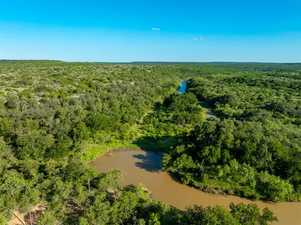 a view of a lake view with houses in back