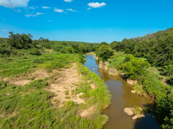 a view of lake with green space