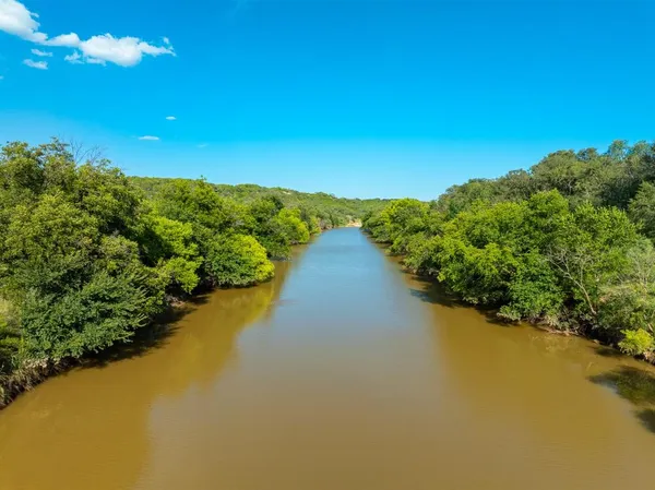 a view of a lake with a city