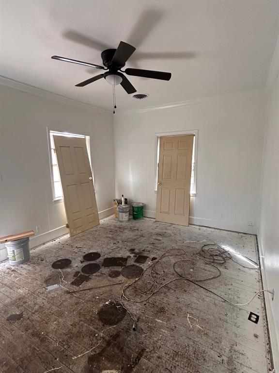 2606 Merwin Street Shreveport, LA 71103 - Photo 2 of 6 Unfurnished room with ornamental molding and ceiling fan