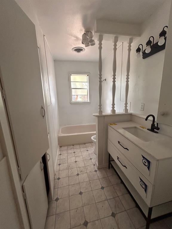 2606 Merwin Street Shreveport, LA 71103 - Photo 3 of 6 Full bathroom featuring vanity and washtub / shower combination