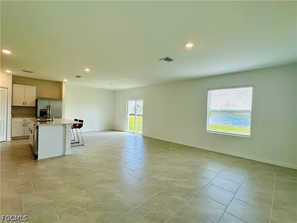 a kitchen with stainless steel appliances a sink stove and cabinets