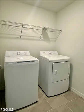 a kitchen with stainless steel appliances a sink a stove a microwave and cabinets