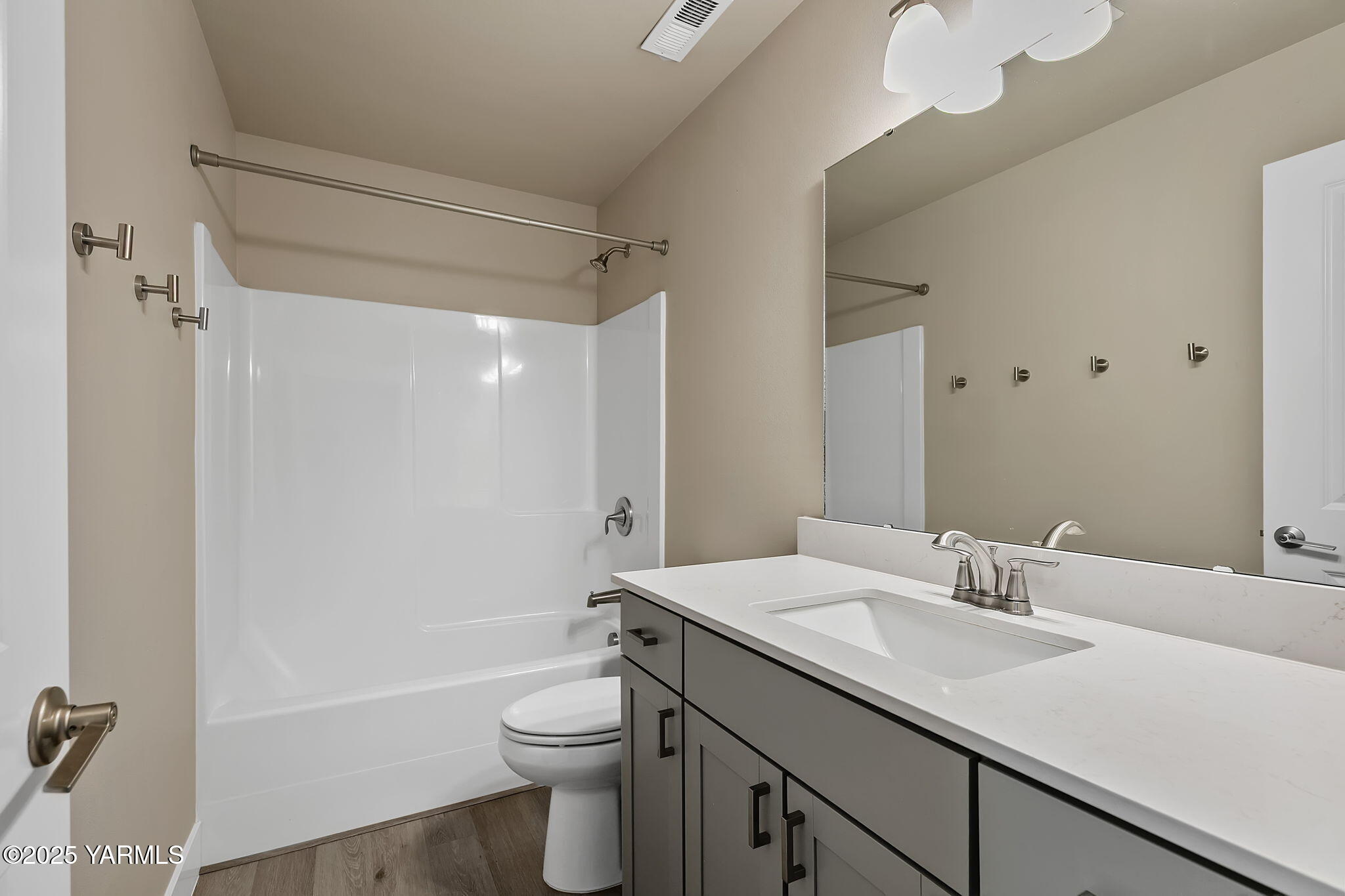 2600 Racquet Lane, Unit 8 Yakima, WA 98902 - Photo 13 of 18 a bathroom with a sink a toilet and shower