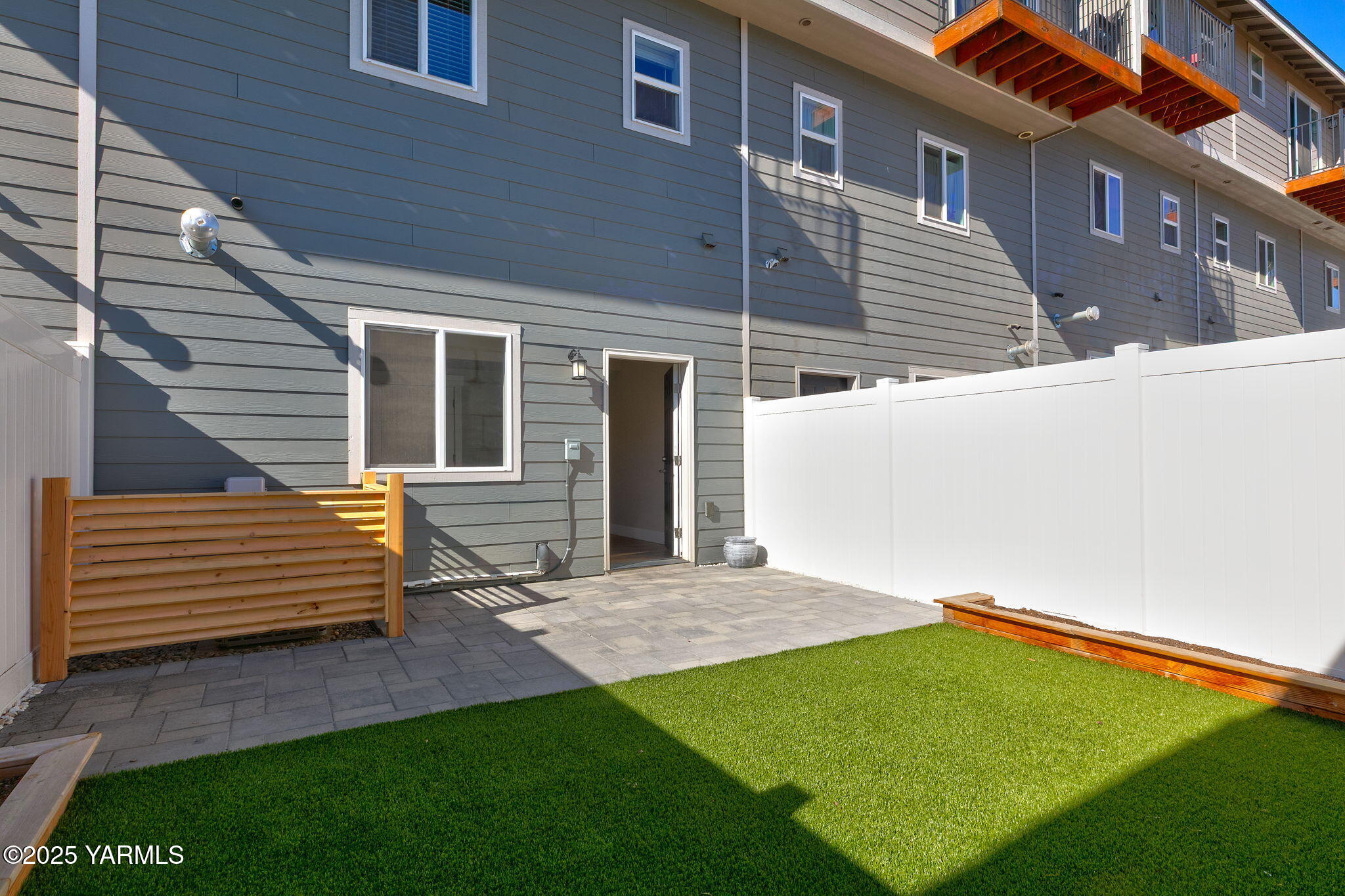 2600 Racquet Lane, Unit 8 Yakima, WA 98902 - Photo 16 of 18 a view of a house with a yard