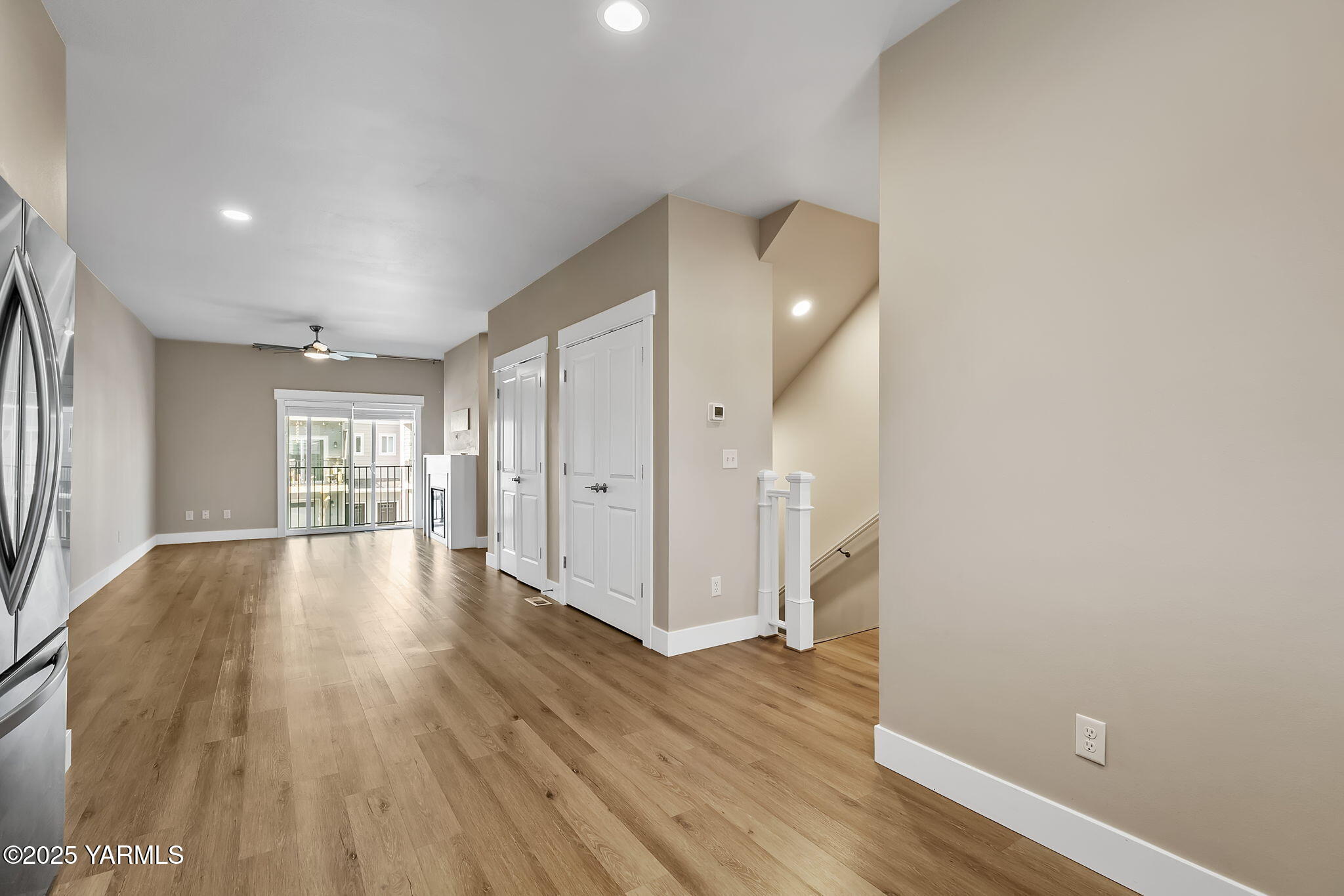2600 Racquet Lane, Unit 8 Yakima, WA 98902 - Photo 5 of 18 a view of an empty room with wooden floor and a window