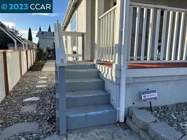 265 Carob Way Pacheco, CA 94553 - Photo 3 of 16 a view of staircase with lots of frames on wall and stairs