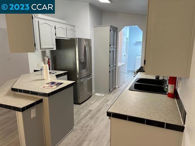 265 Carob Way Pacheco, CA 94553 - Photo 7 of 16 a kitchen with kitchen island a sink stove and refrigerator
