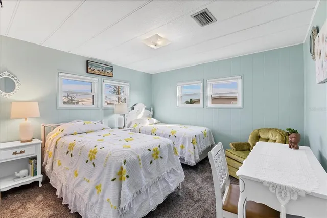 a bedroom with bed and a window