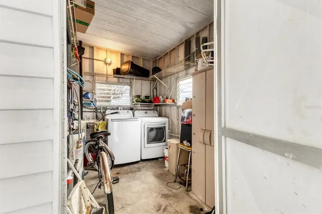 a view of a storage & utility room with washer and dryer