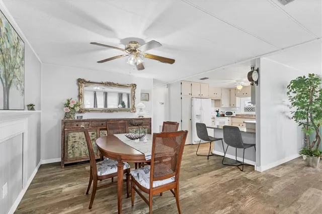 a view of a dining room with furniture and a livingroom