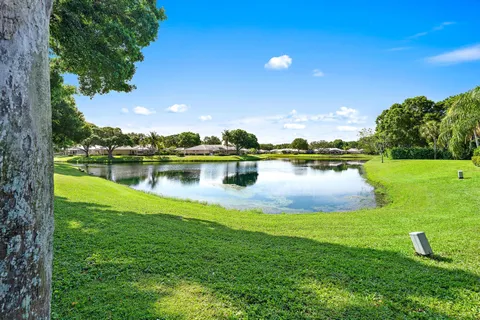 a view of a lake with houses in the back