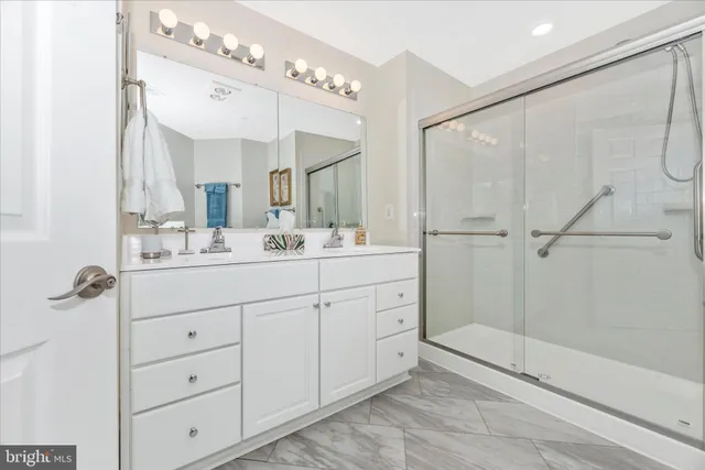 a bathroom with a double vanity sink mirror and double