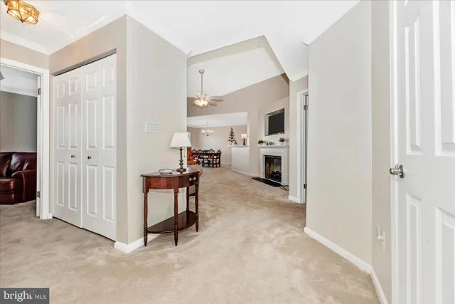 a view of kitchen with furniture and a refrigerator