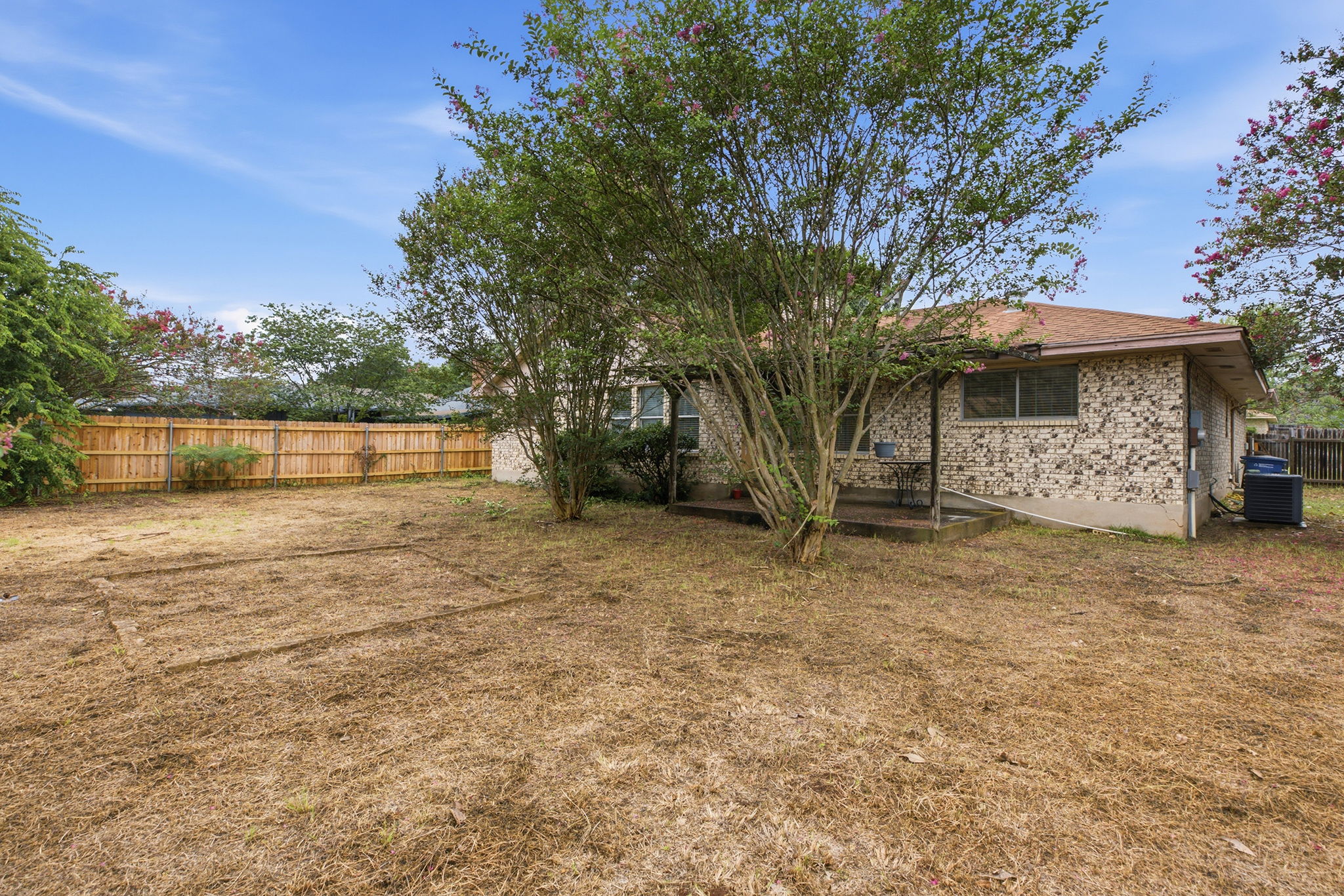 7205 Beckett Road Austin, TX 78749 - Photo 31 of 40 A private, fenced backyard offers a secure and versatile outdoor space.