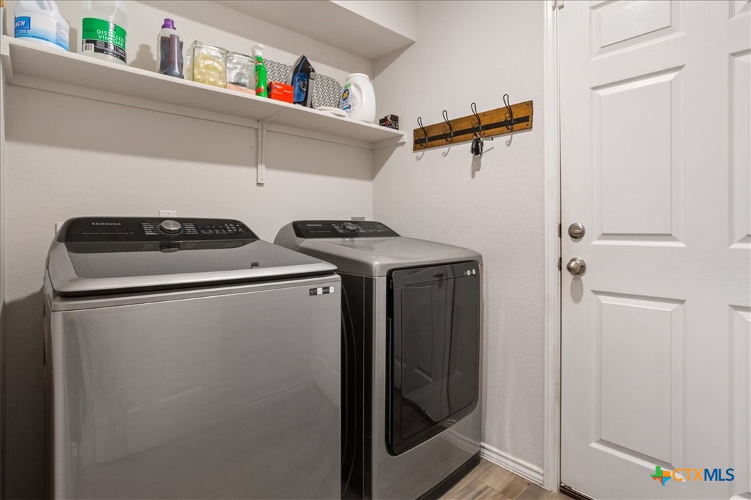 1000 Velvet Court Troy, TX 76579 - Photo 21 of 25 a utility room with dryer and washer
