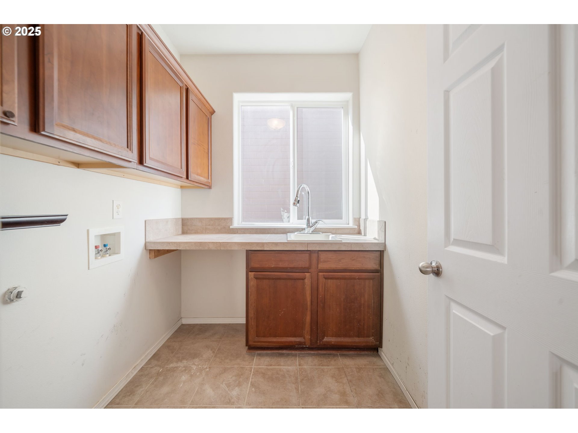 39784 Syblon Lane Sandy, OR 97055 - Photo 11 of 24 a kitchen with granite countertop a sink and dishwasher with wooden floor