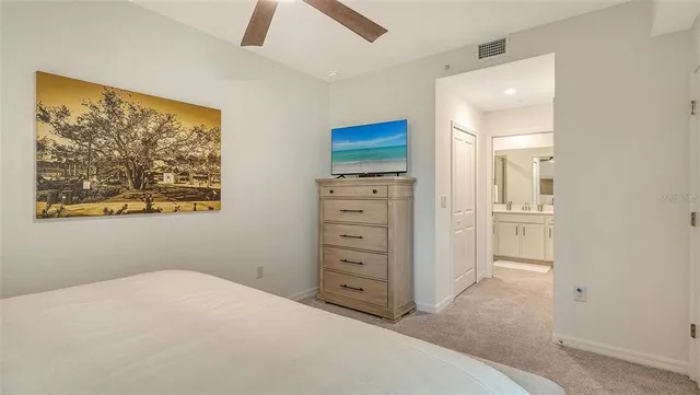 a view of a lake with houses in the back