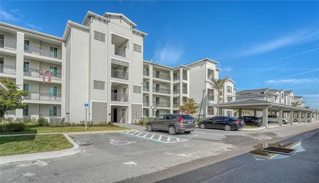 a bedroom with furniture and a flat screen tv