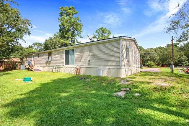 a view of a backyard with a garden and plants