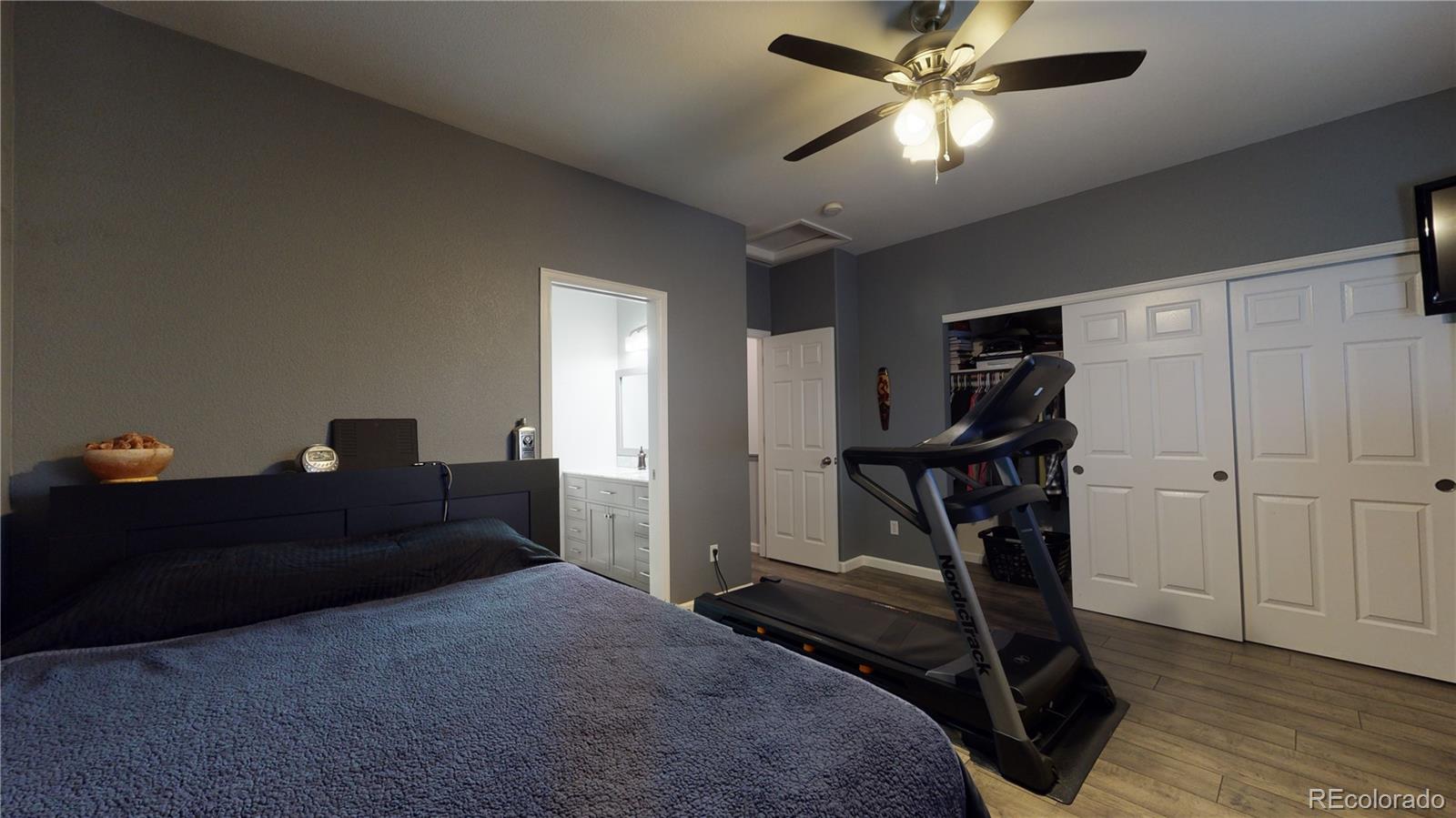 8199 Welby Road, Unit 4001 Denver, CO 80229 - Photo 11 of 24 a living room with furniture and a ceiling fan