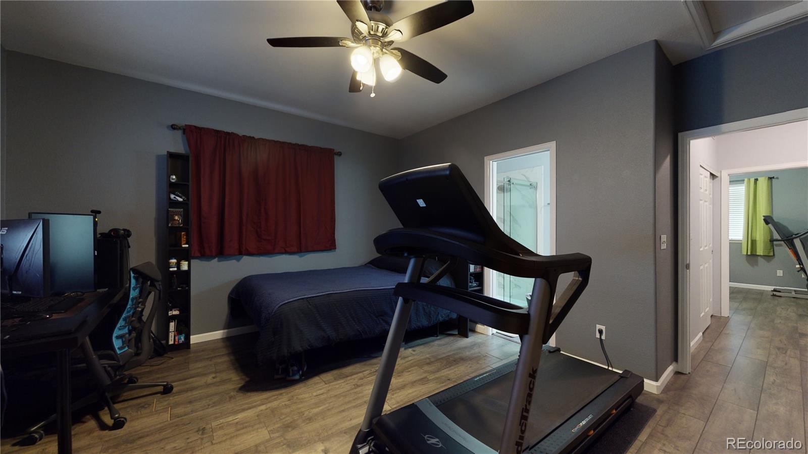 8199 Welby Road, Unit 4001 Denver, CO 80229 - Photo 12 of 24 a living room with furniture and a flat screen tv