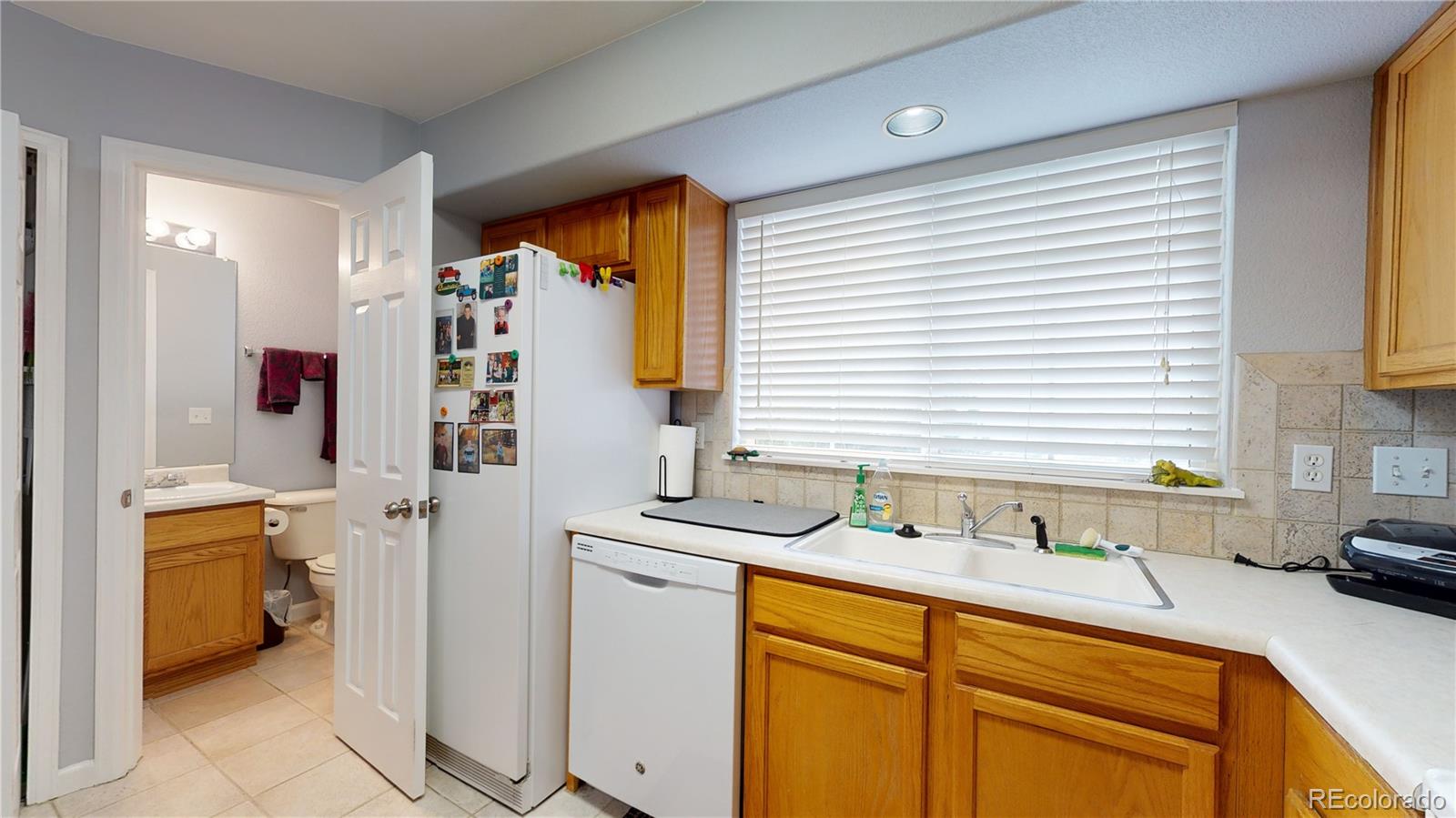 8199 Welby Road, Unit 4001 Denver, CO 80229 - Photo 8 of 24 a bathroom with a sink and a tub