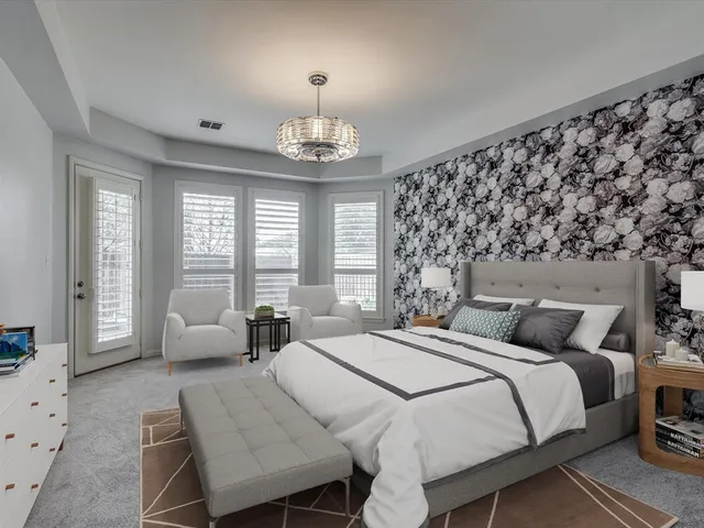 a bedroom with bed and wooden floor