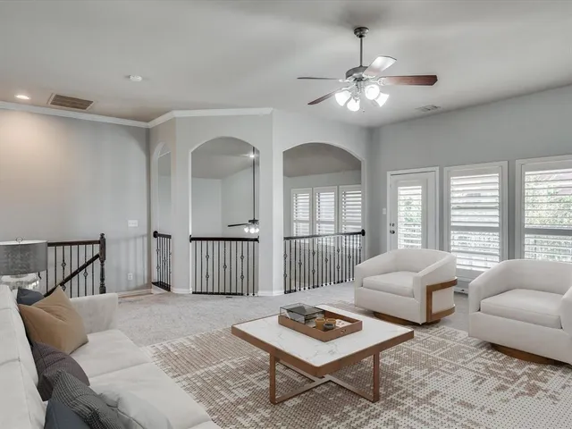 a living room with furniture and a table