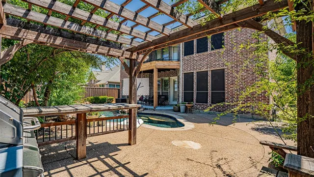 a front view of house with yard outdoor seating and barbeque oven