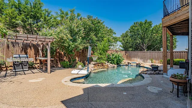 a view of a backyard with sitting area