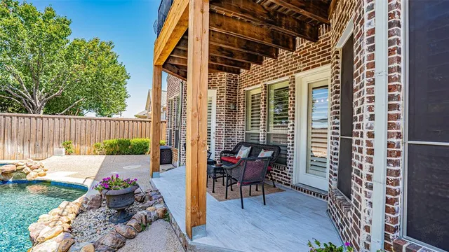 a view of a swimming pool with a yard