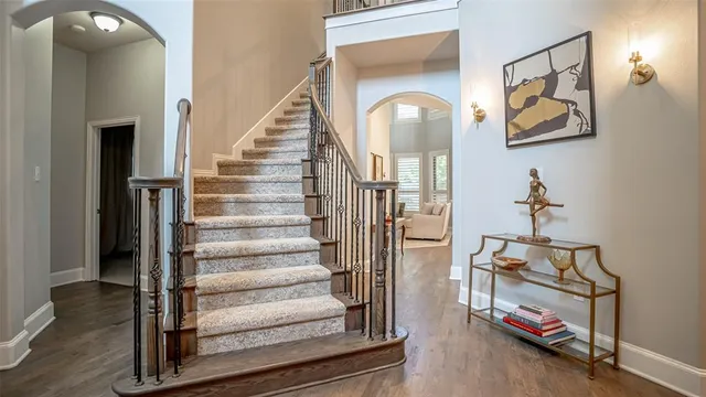 a view of an entryway with wooden floor