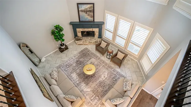 a view of living room with furniture and a fireplace