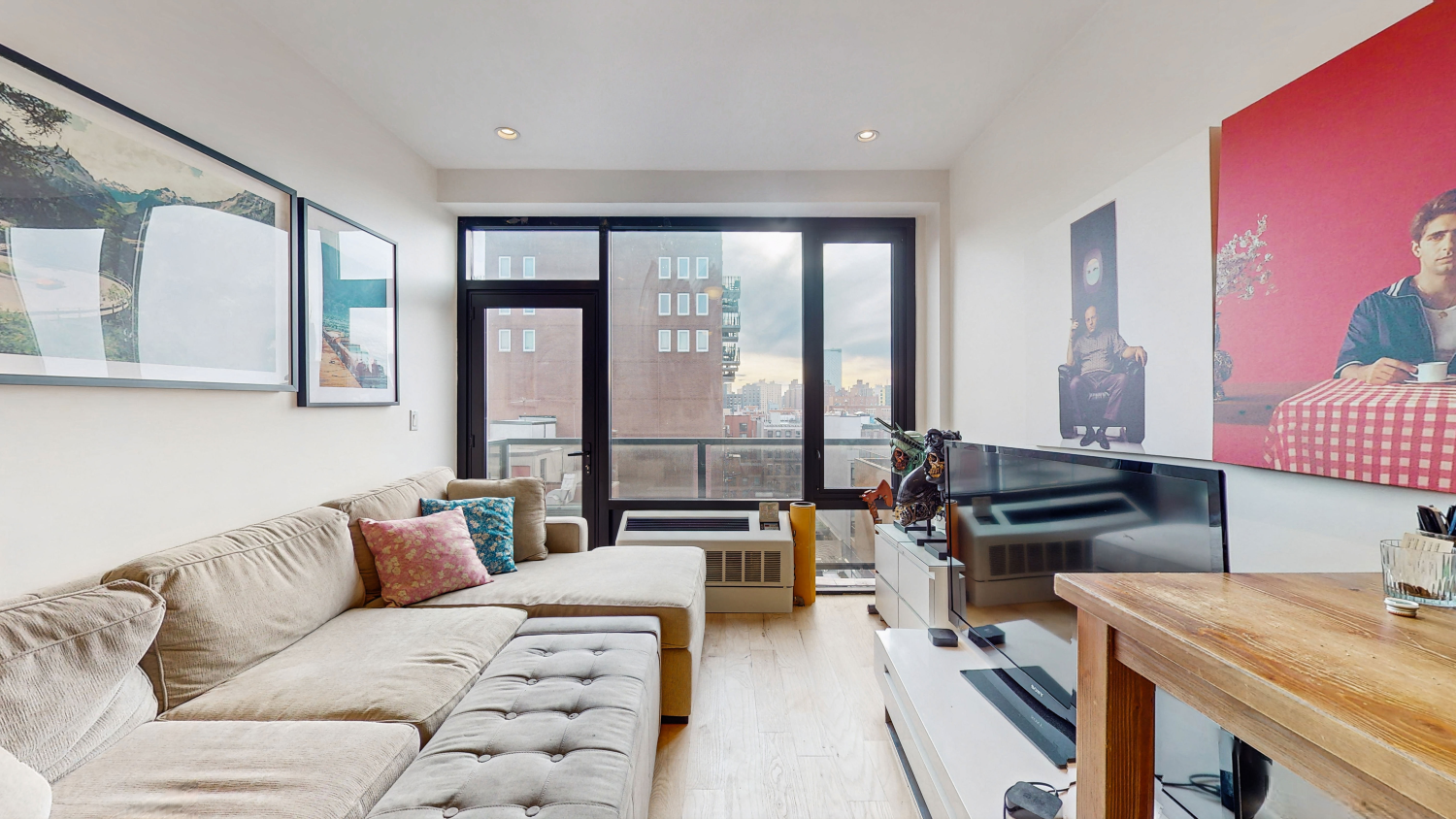 a living room with furniture and large windows