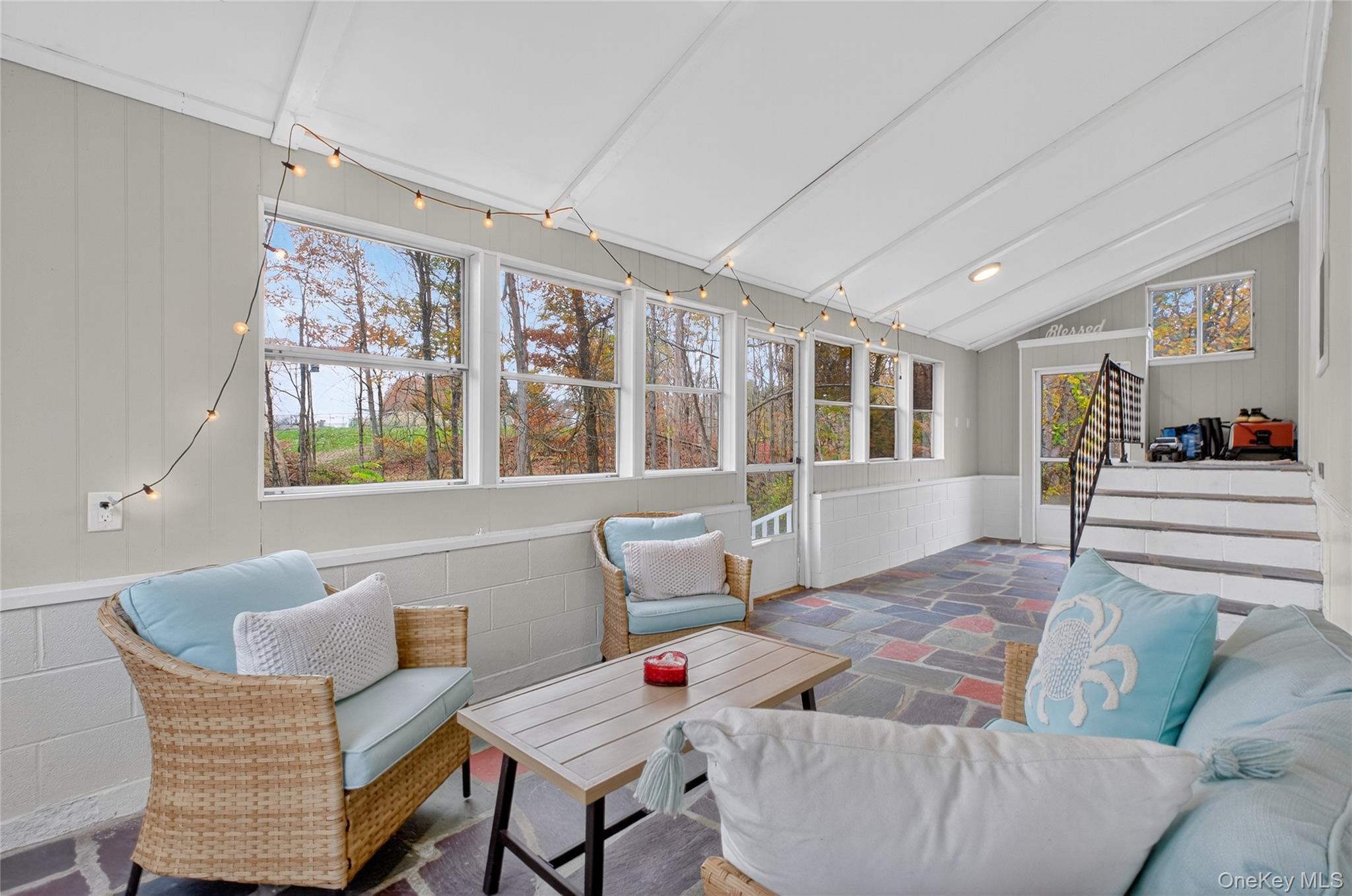 12 Russell Road Wappingers Falls, NY 12590 - Photo 16 of 34 a living room with patio furniture and a wooden floor