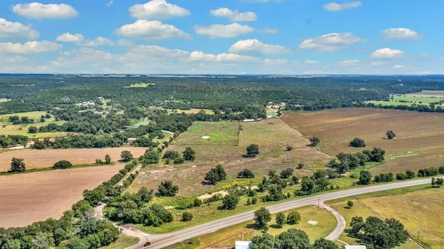 an aerial view of a houses with outdoor space