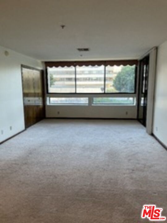 880 West 1st Street, Unit 613 Los Angeles, CA 90012 - Photo 7 of 27 a view of an empty room with a window