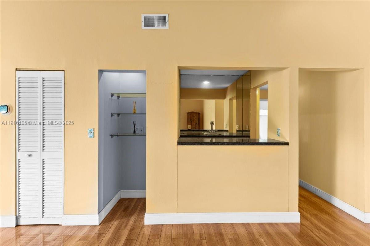 9231 Southwest 150th Avenue Miami, FL 33196 - Photo 12 of 51 a view of a kitchen from the hallway