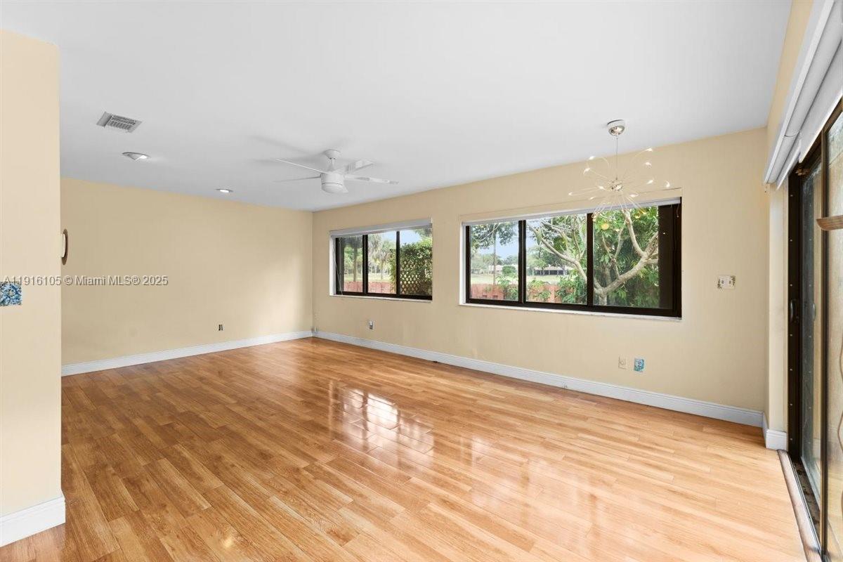 9231 Southwest 150th Avenue Miami, FL 33196 - Photo 21 of 51 a view of an empty room with a window