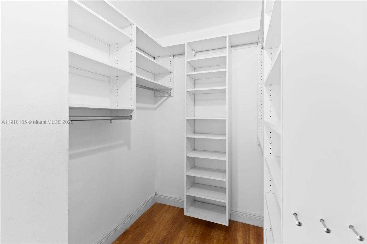 9231 Southwest 150th Avenue Miami, FL 33196 - Photo 26 of 51 a view of walk in closet with empty racks