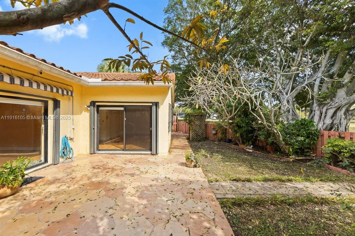 9231 Southwest 150th Avenue Miami, FL 33196 - Photo 39 of 51 a view of a house with a door