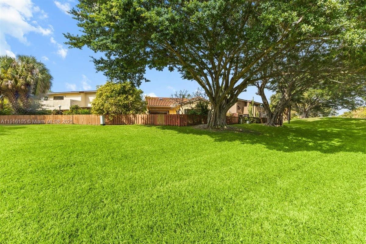 9231 Southwest 150th Avenue Miami, FL 33196 - Photo 44 of 51 a view of a backyard with large trees