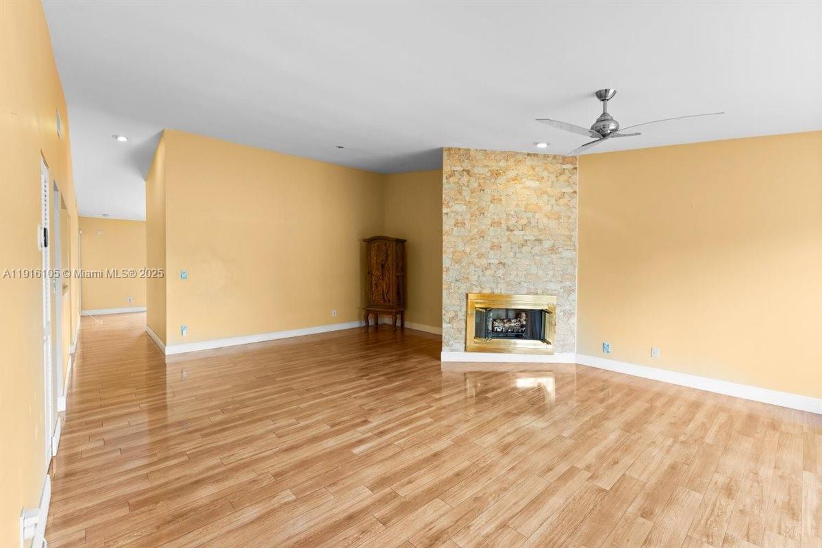 9231 Southwest 150th Avenue Miami, FL 33196 - Photo 10 of 51 a view of an empty room with a window and fireplace