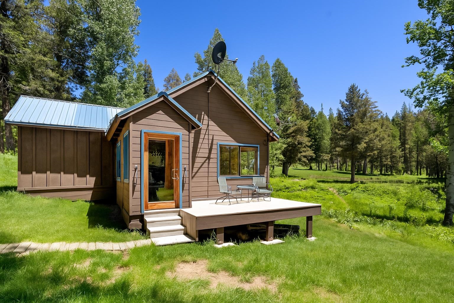 40600 Highway 49 Calpine, CA 96124 - Photo 20 of 28 a view of a house with backyard and a tree