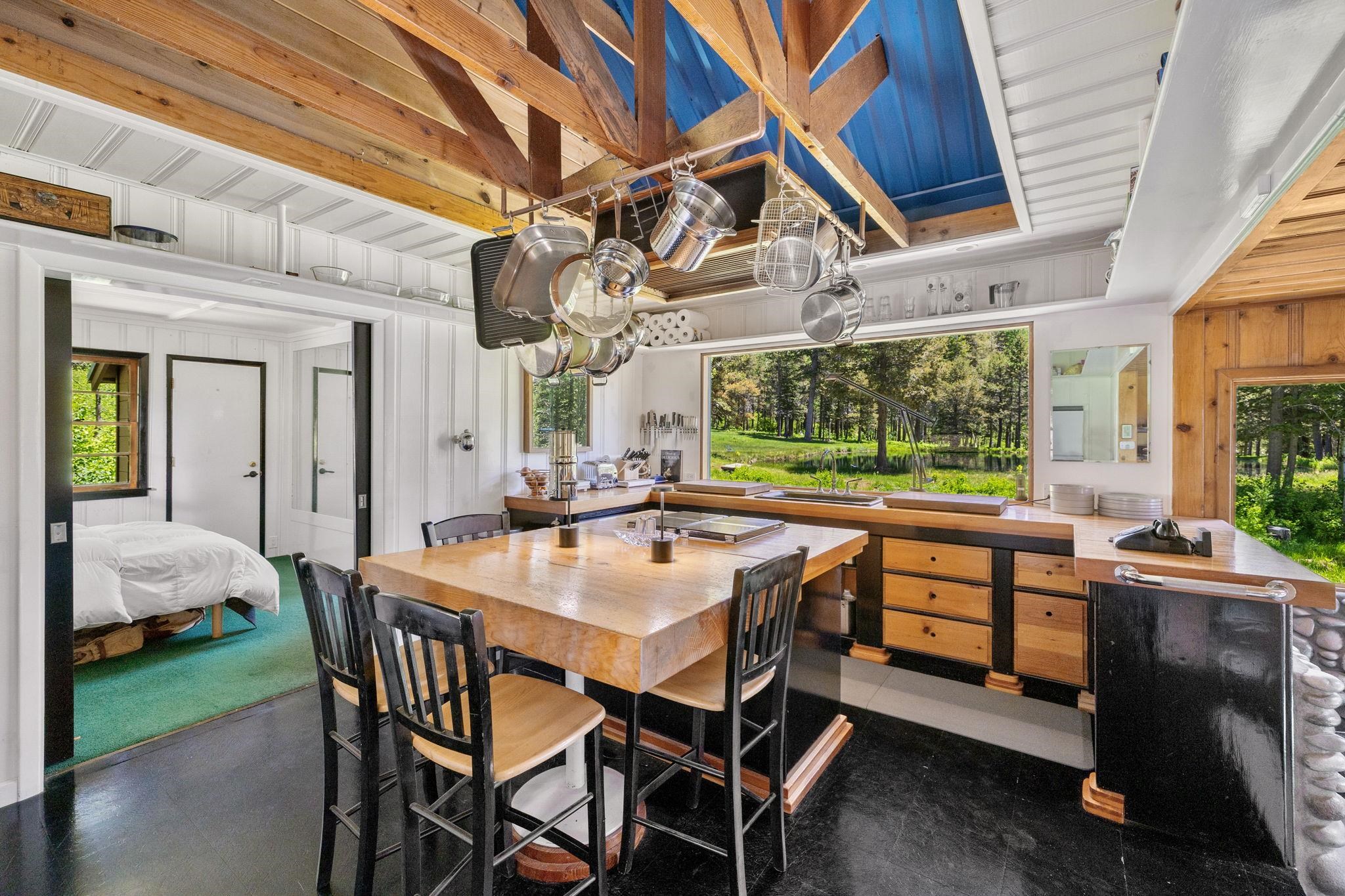 40600 Highway 49 Calpine, CA 96124 - Photo 21 of 28 a dining room with a wooden table and chairs