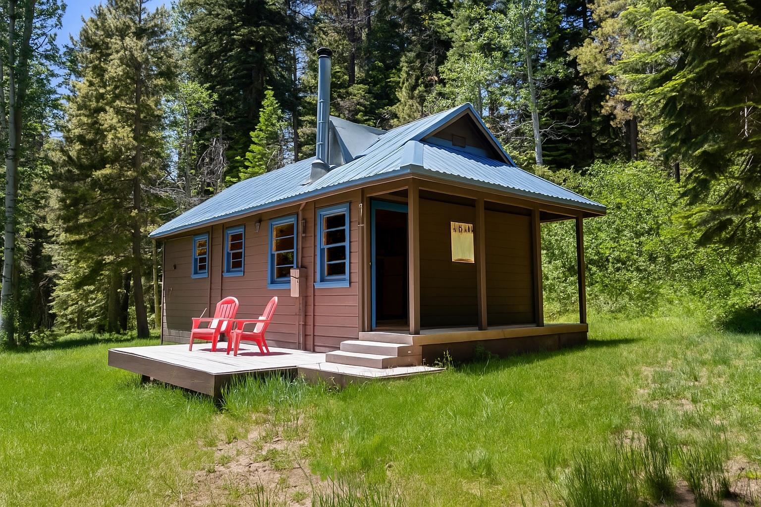 40600 Highway 49 Calpine, CA 96124 - Photo 24 of 28 a front view of a house with a yard balcony and outdoor seating