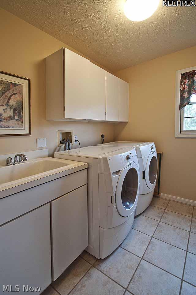 357 Longspur Road Highland Heights, OH 44143 - Photo 18 of 22 Large, Bright Laundry Room with Porcelain Tile Flooring, Built-in Cabinets and Sink