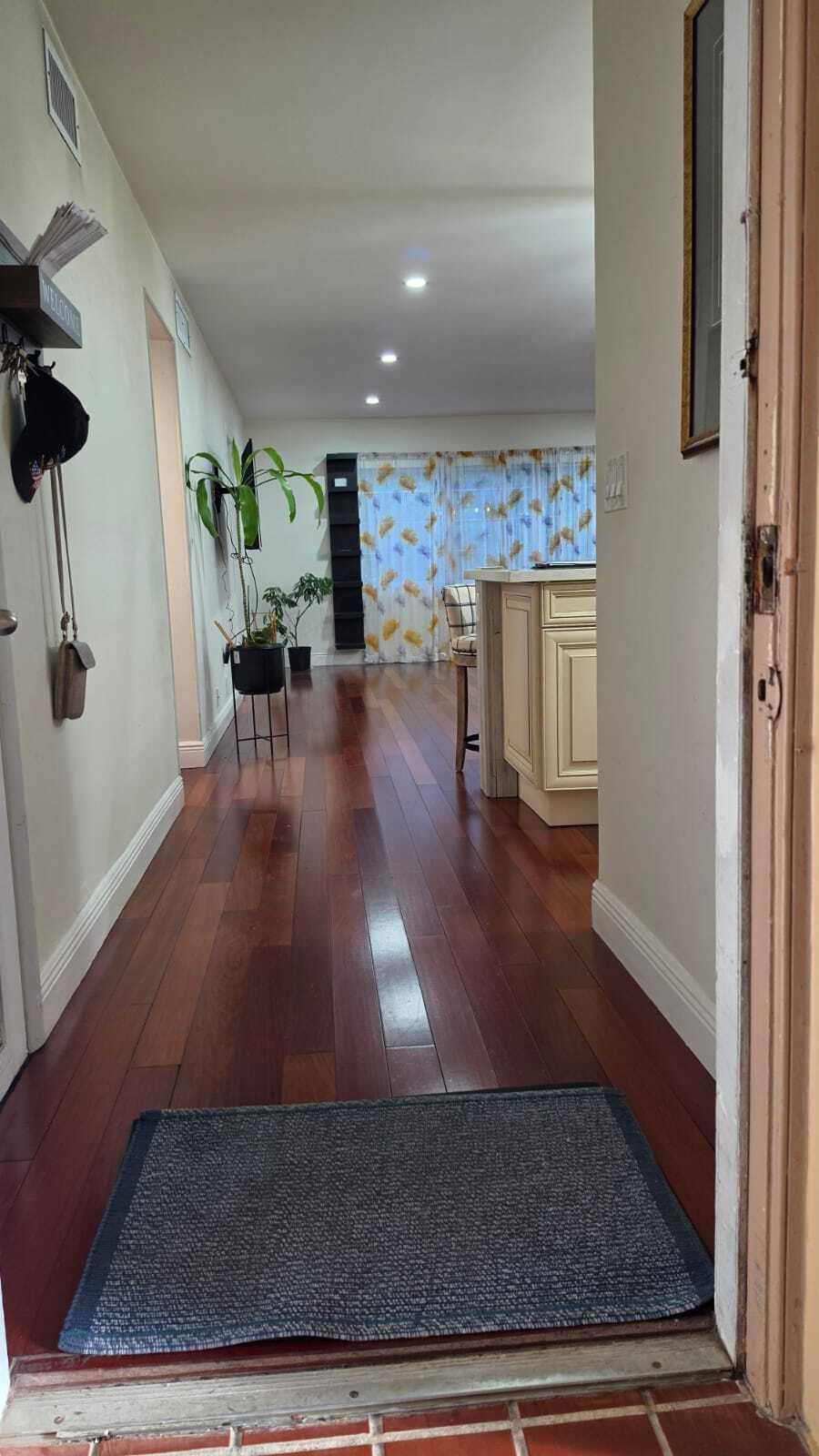 100 Ashbury Road, Unit 206 Hollywood, FL 33024 - Photo 4 of 23 wooden floor in living room with a rug
