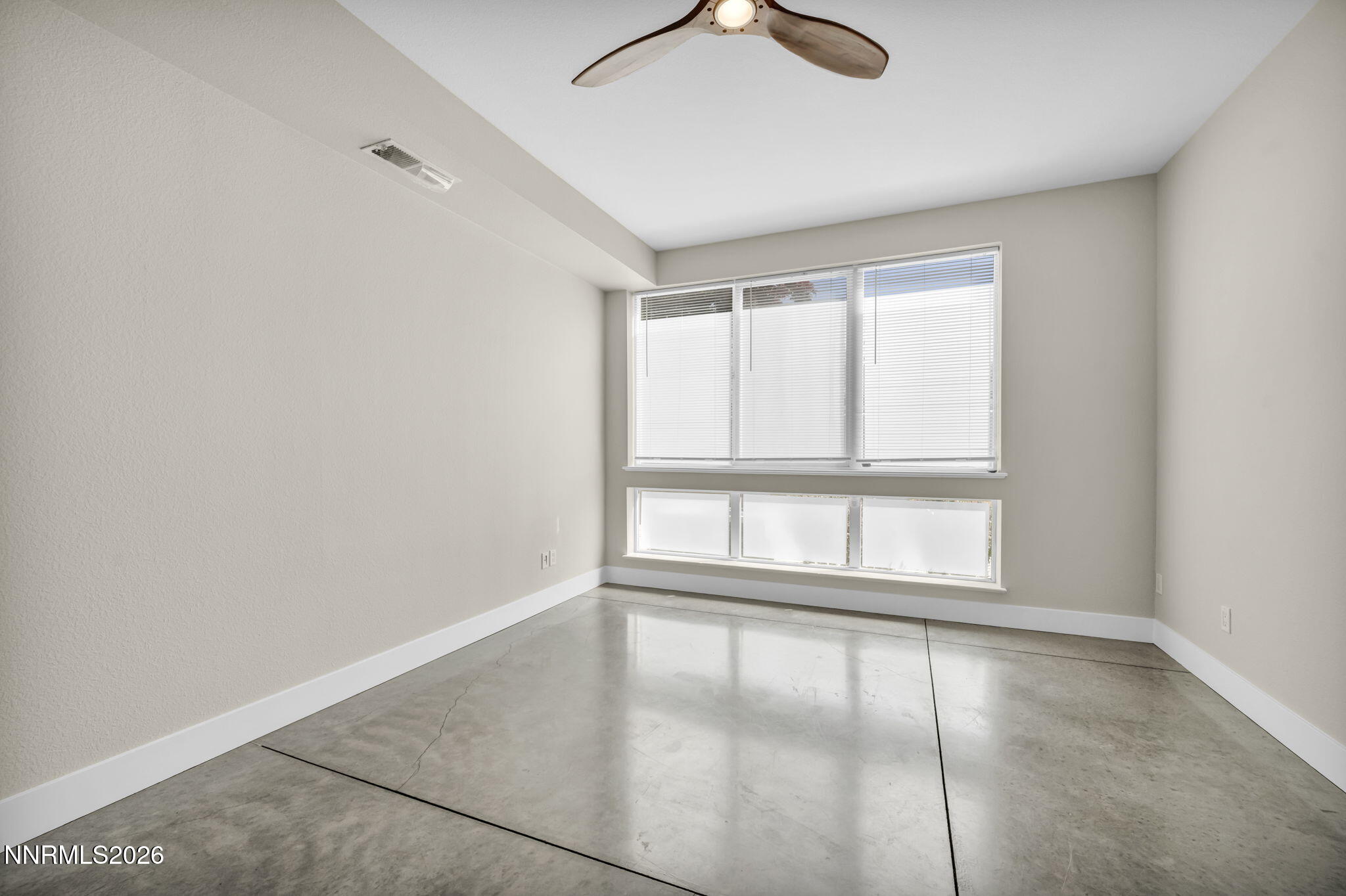 326 State Street Reno, NV 89501 - Photo 7 of 49 an empty room with wooden floor and windows
